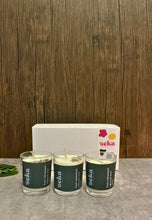 Load image into Gallery viewer, Three 'seka' candles on a gray surface with a wooden background
